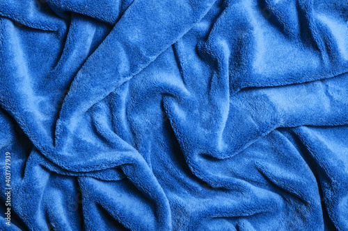 Soft fabric background. Blue blanket texture. Wave material pattern. Decorative curtain textile background. Wool texture. Cotton fabric pattern.