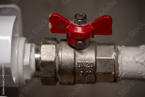 Radiator valve with red handle. Regulating fittings for heating a home battery. Ventel