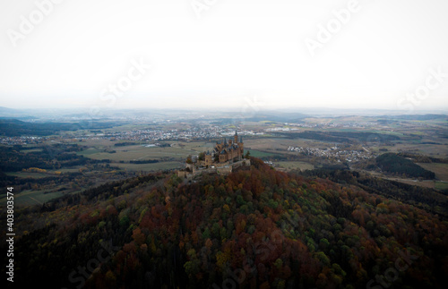 Aerial panorama of medieval gothic mountain hilltop castle Burg Hohenzollern Hechingen Swabian Jura alps autumn Germany photo