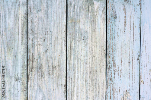 background from old wooden planks painted with blue paint. Texture.