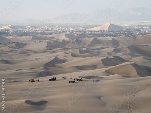 Four wheel drive 4WD 4x4 dune beach buggy motor vehicle tour in sand desert Huacachina Ica Peru South America photo