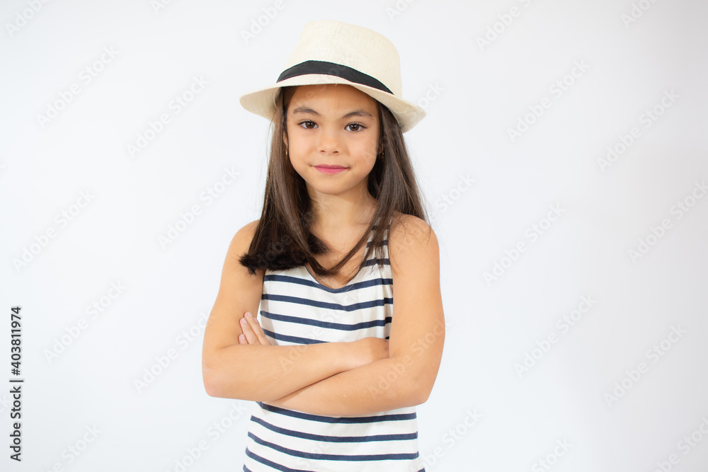 Enjoying vacation. Good vibes. Beach style. Little beauty in straw hat. Portrait of happy cheerful girl in summer hat over white background. Enjoying vacation. Good vibes. Beach style. Little beauty in straw hat. Portrait of happy cheerful girl in summer hat over white background.
