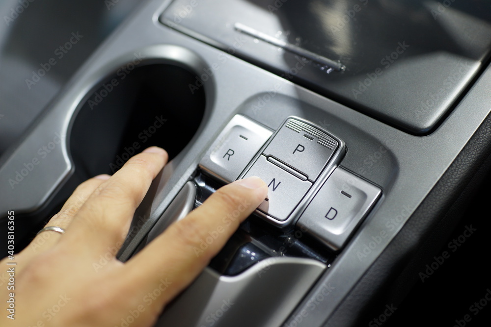 Automatic gear button inside a modern sports car. Automatic gear button inside a modern sports car.