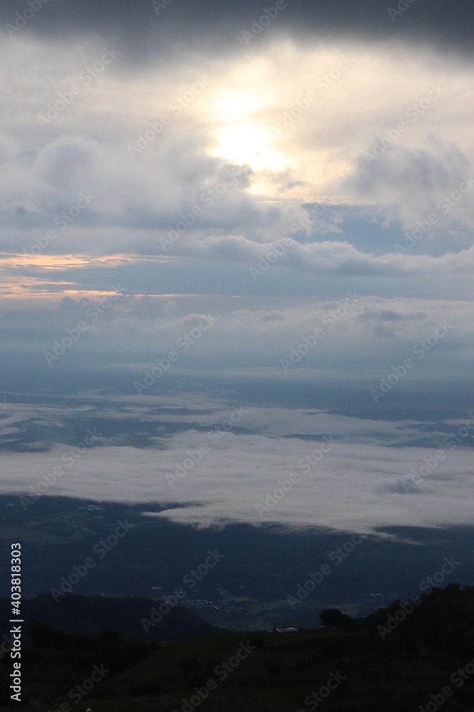 Landscape photos Nature from the top of the mountain There are many trees And clouds above And there are shadows from the clouds Light shade of sunlight Gives a cool feeling Ideas for travel pictures.