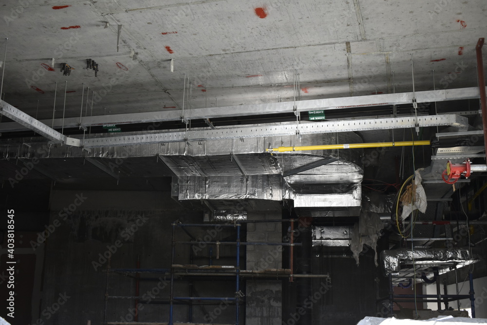 MEP works in civil construction site. Aluminum fabricated air flow duct and steel tray supporting works. ducting work. duct Insulation. HVAC system in the construction site. MEP works in civil construction site. Aluminum fabricated air flow duct and steel tray supporting works. ducting work. duct Insulation. HVAC system in the construction site.
