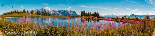 High resolution stitched panorama of a beautiful alpine summer view with reflections in a lake at the famous Hartkaiser summit, Ellmau, Wilder Kaiser, Tyrol, Austria photo