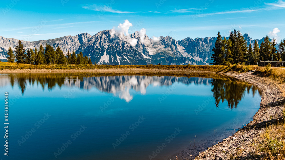 Beautiful alpine summer view with reflections in a lake at the famous Hartkaiser summit, Ellmau, Wilder Kaiser, Tyrol, Austria