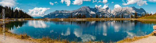 High resolution stitched panorama of a beautiful alpine summer view with reflections in a lake at the famous Astberg summit, Going, Wilder Kaiser, Tyrol, Austria photo