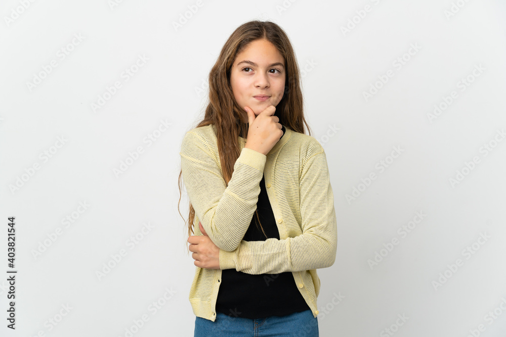 Little girl over isolated white background thinking an idea while looking up Little girl over isolated white background thinking an idea while looking up