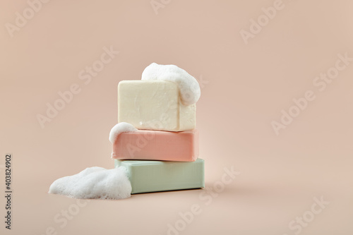 pieces of soap on a beige background photo