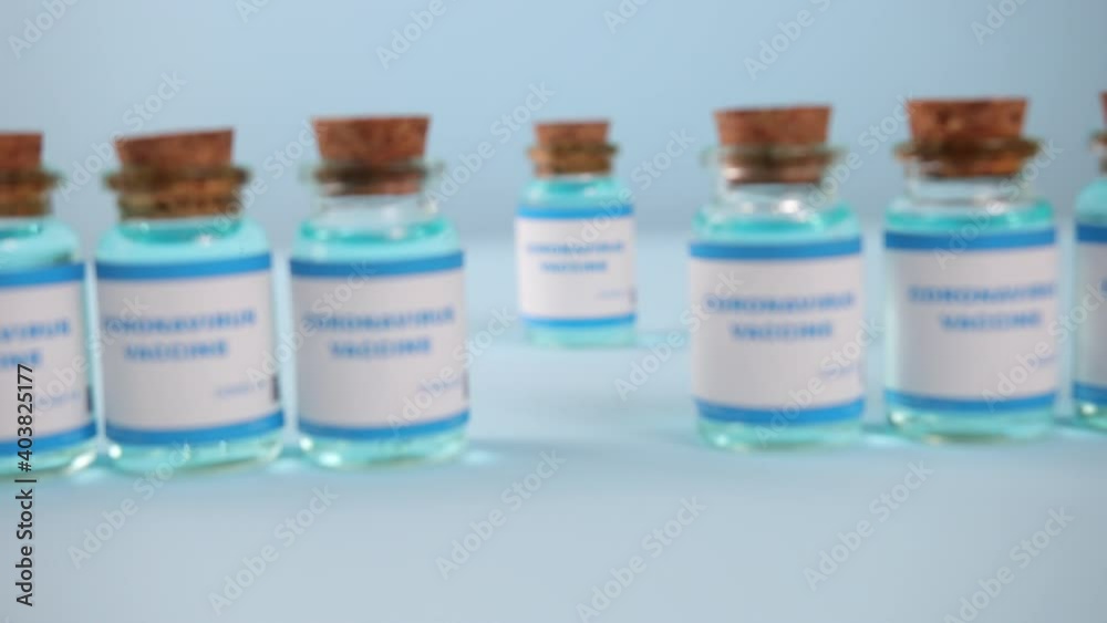 Coronavirus medication. Coronavirus covid-19 vaccine. A glass vial of the covid-19 vaccine. Hypodermic injection dose for prevention immune treatment illness virus disease. Coronavirus medication. Coronavirus covid-19 vaccine. A glass vial of the covid-19 vaccine. Hypodermic injection dose for prevention immune treatment illness virus disease.