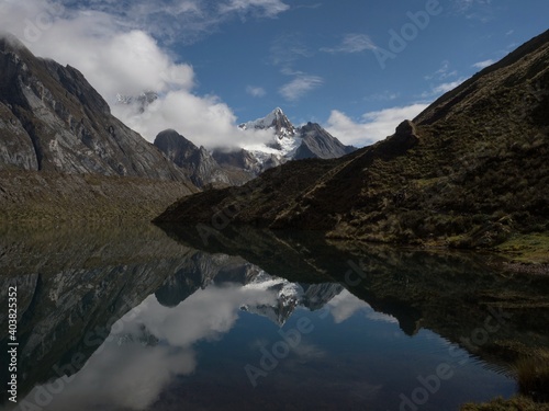 Panorama lake reflection of Cordillera Huayhuash Circuit mountain range in Laguna Siula andes Huanuco Peru South America photo