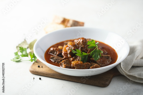 Healthy homemade beef goulash with fresh parsley