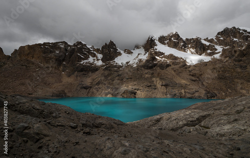 Panorama view of turquoise Cordillera Huayhuash Circuit alpine andes mountain lake Trapecio Ancash Peru South America photo