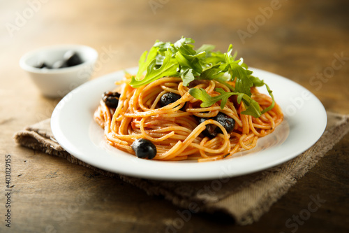 Pasta with olives and arugula