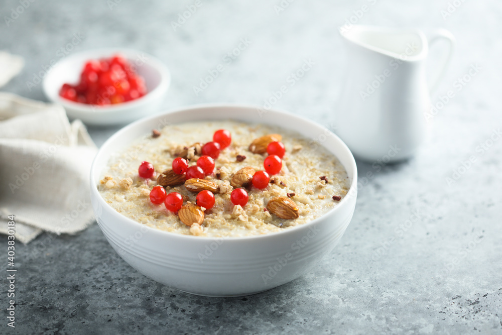 Healthy oatmeal porridge with berries and almond Healthy oatmeal porridge with berries and almond