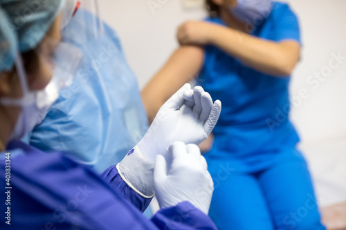 Shallow depth of field (selective focus) image with details of Covid- 19 vaccine administration in the hospital.