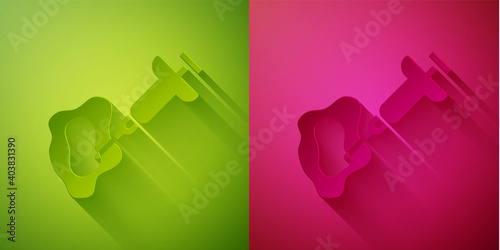 Paper cut GMO syringe icon isolated on green and pink background. Genetically modified organism acronym. Dna food modification. Paper art style. Vector.