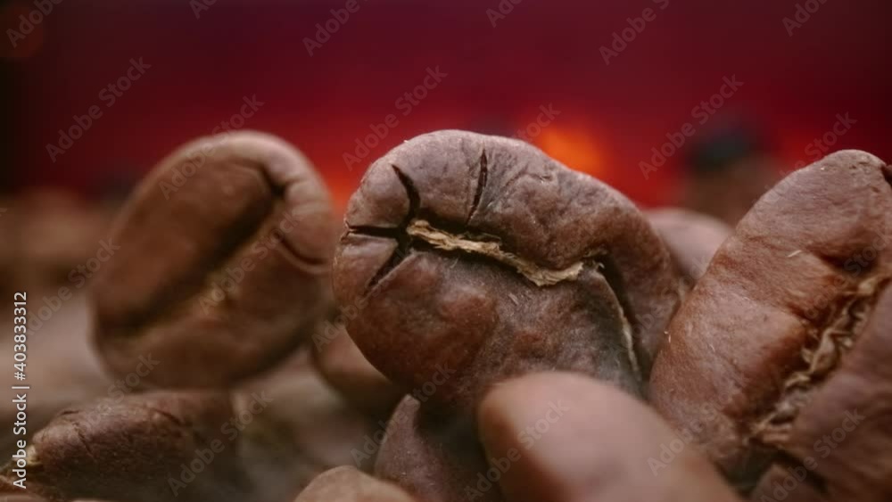 Close up of seeds of coffee. Fragrant coffee beans are roasted smoke comes from coffee beans. Close up of seeds of coffee. Fragrant coffee beans are roasted smoke comes from coffee beans.