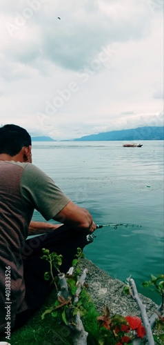 person sitting on the rocks