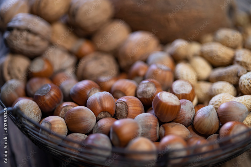 still life with hazelnut peanuts walnut and coconut on wooden board still life with hazelnut peanuts walnut and coconut on wooden board