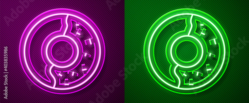 Glowing neon line Donut with sweet glaze icon isolated on purple and green background. Vector Illustration.
