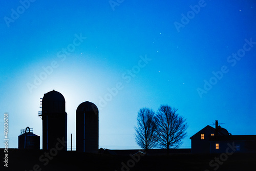 Blue Moonrise silhouettes Vermont Farm house and silos photo