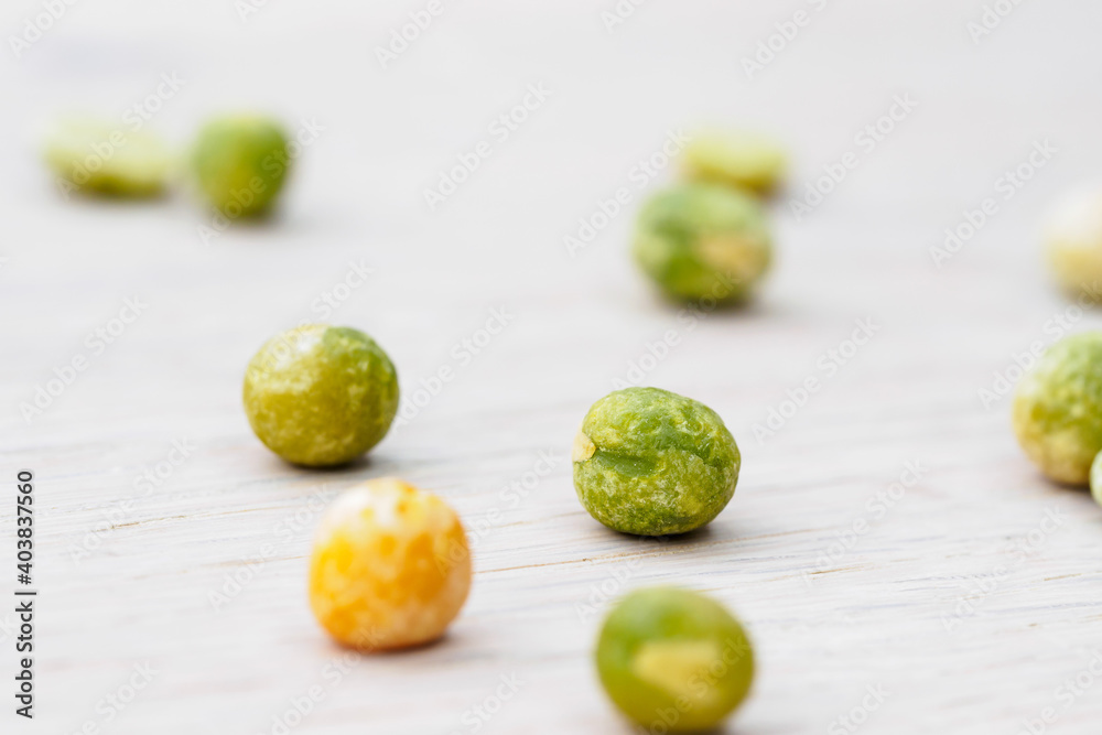 green and yellow peas on white background