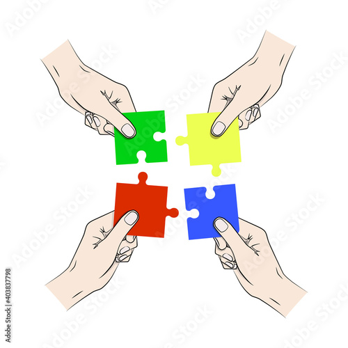 Four hands putting together a blue, green, red and yellow puzzle.
