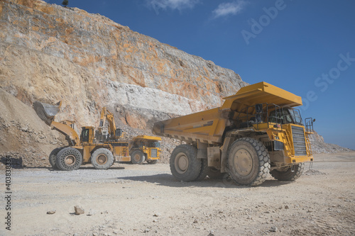 Mining equipment working in open pit photo