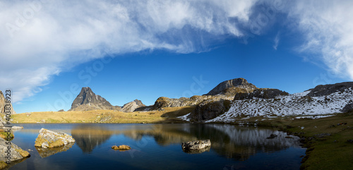 Midi Dossau Peak reflected in Casterau lake. Ayous Lakes area in Ossau Valley, Pyrenees in France.