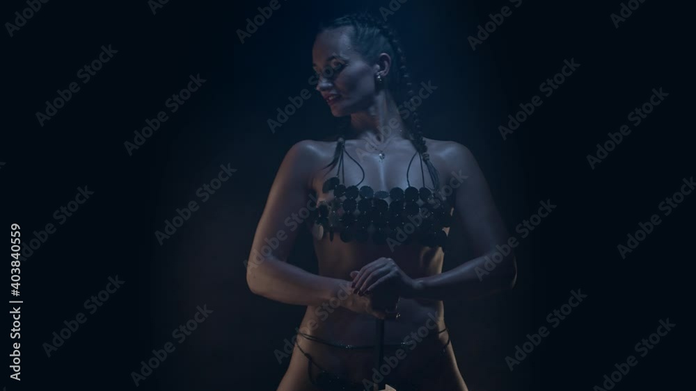 Amazon woman fantasy character, low key. Slow motion Amazon woman fantasy character, low key. Slow motion
