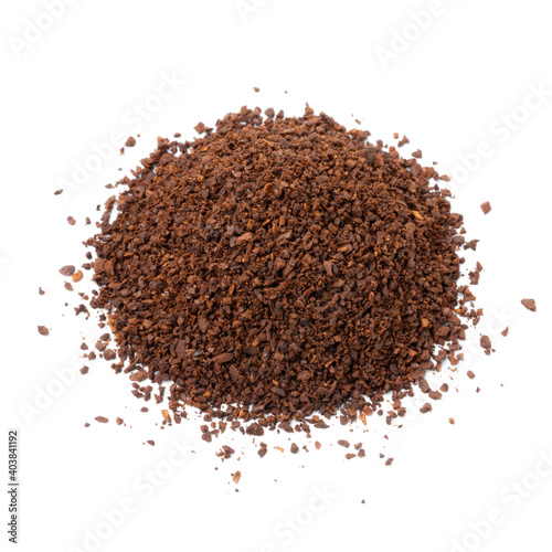 Heap of coarse ground roasted coffee isolated on white background