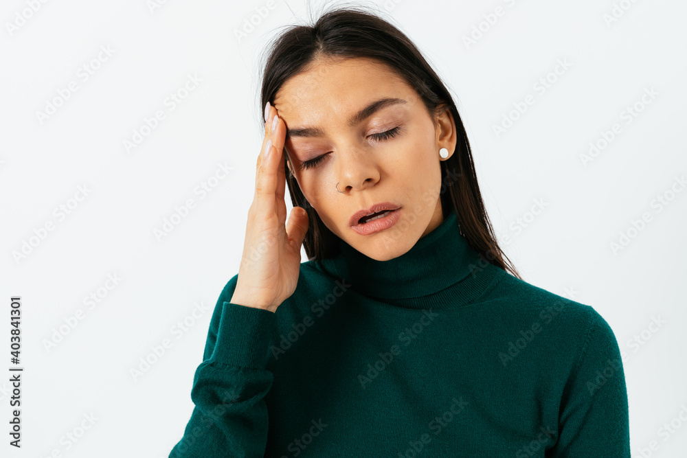 Portrait of a young brunette woman in a green sweater Portrait of a young brunette woman in a green sweater