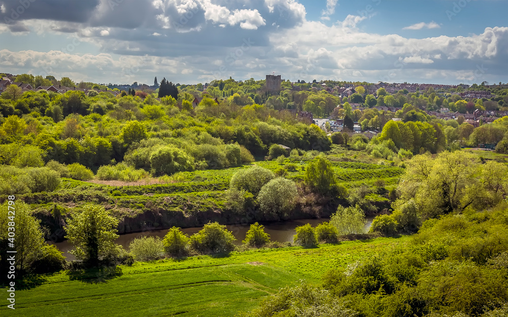 Fototapeta premium A view from the Conisbrough Viaduct across the River Don towards Conisbrough, Yorkshire, UK in springtime