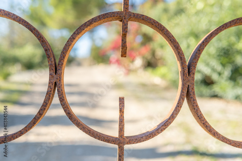 Focused rusty circular iron fence