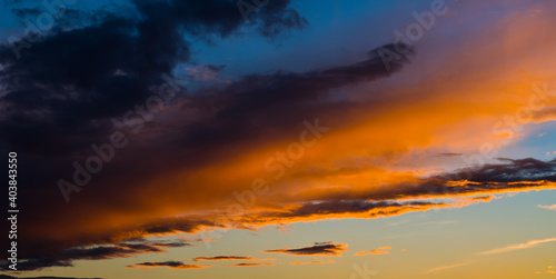 Sunset sky with beautiful black and orange clouds