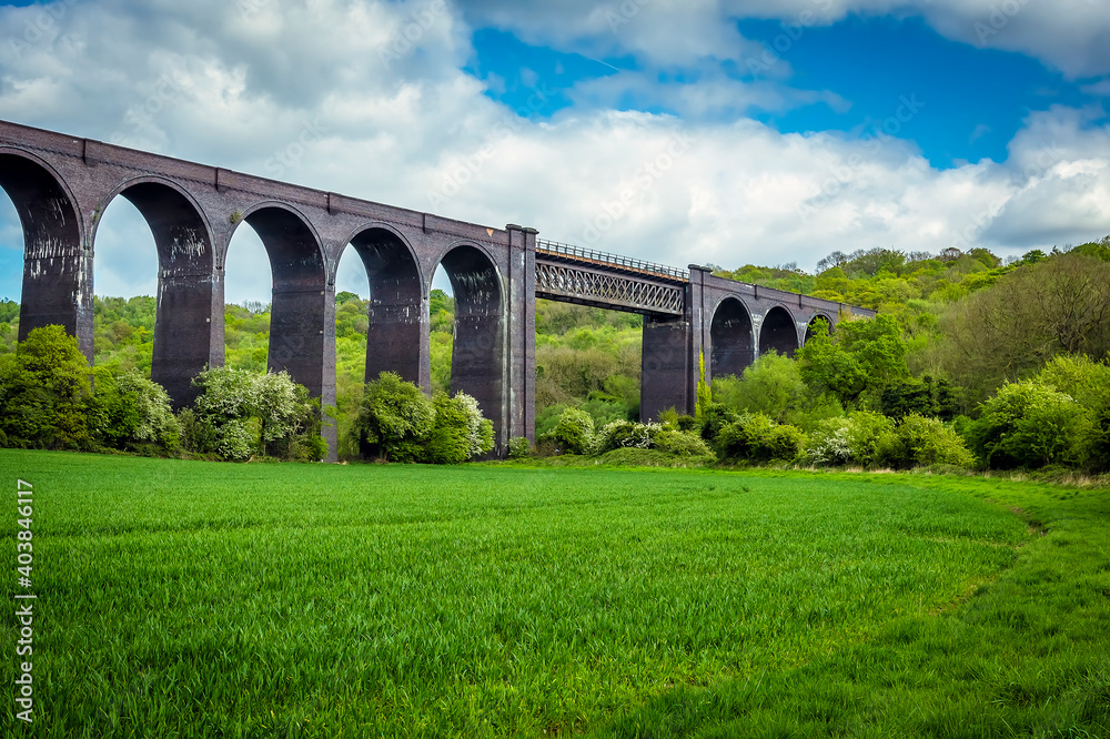 A view of the Conisbrough Viaduct and the girder span over the River Don at Conisbrough, Yorkshire, UK in springtime