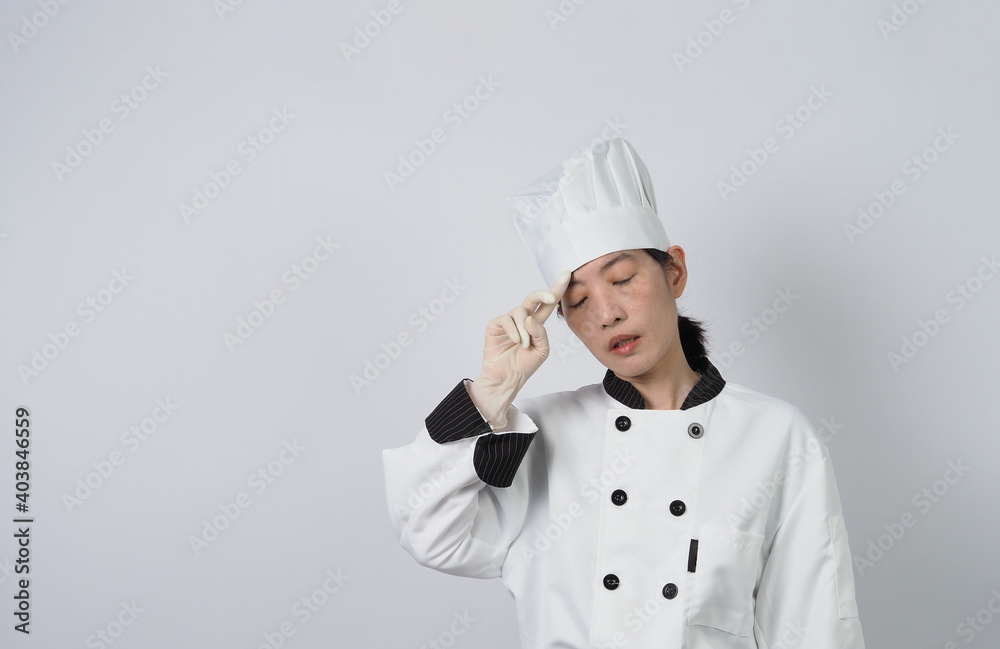 Chef gesturing. Portrait beautiful asian woman cook wearing hat and chef uniform making gesture sign and looking at the camera. Influencer. Cooking class. Copy space. Online food merchant chef. Chef gesturing. Portrait beautiful asian woman cook wearing hat and chef uniform making gesture sign and looking at the camera. Influencer. Cooking class. Copy space. Online food merchant chef.