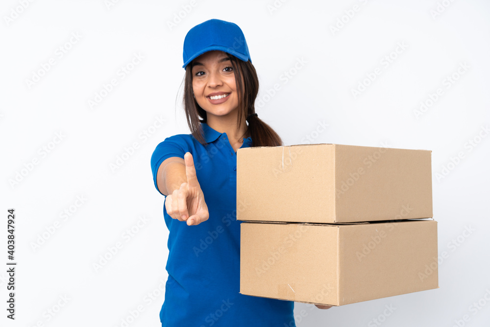 Young delivery brunette girl over isolated white background showing and lifting a finger Young delivery brunette girl over isolated white background showing and lifting a finger