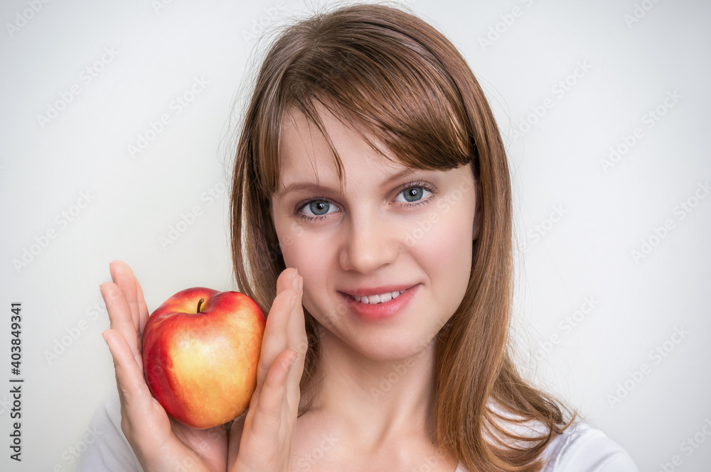 Woman with apple isolated on white - healthy diet concept Woman with apple isolated on white - healthy diet concept