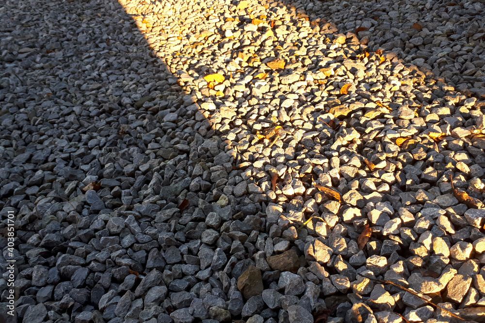 Obraz premium Natural stone pebble material texture background. stone background, dark gravel pebbles stone