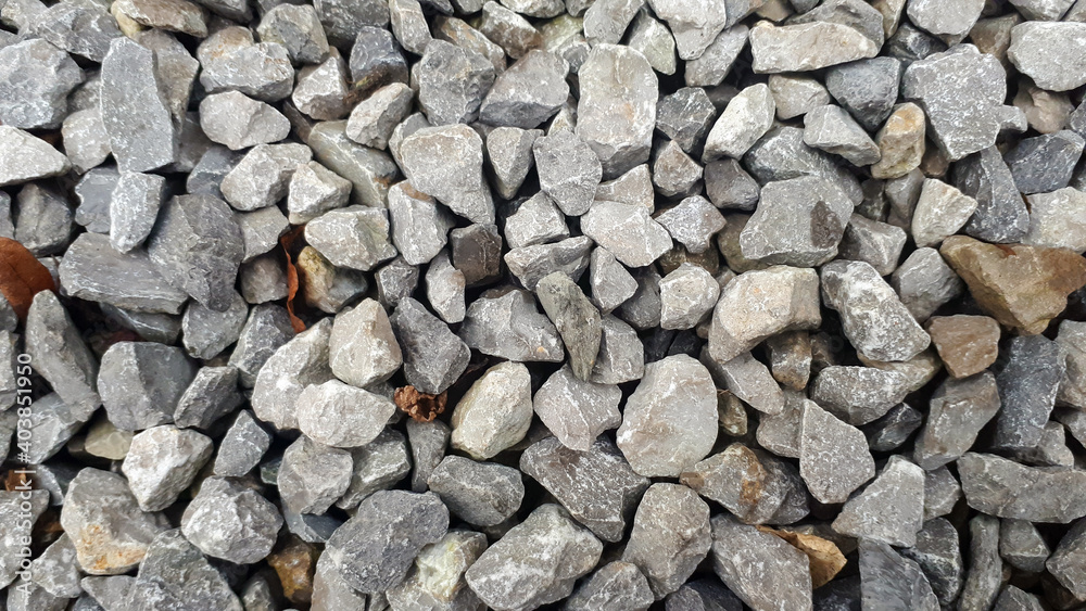 Natural stone pebble material texture background. stone background, dark gravel pebbles stone Natural stone pebble material texture background. stone background, dark gravel pebbles stone