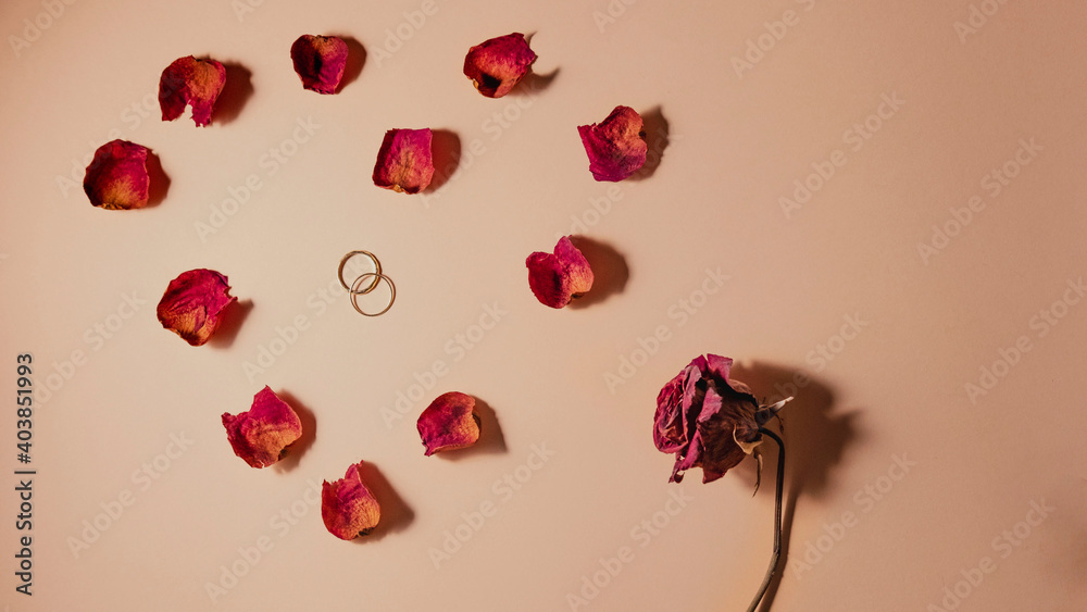 Rose and red dried petals with rings inside a heart. Love concept. Valentine's day. Rose and red dried petals with rings inside a heart. Love concept. Valentine's day.