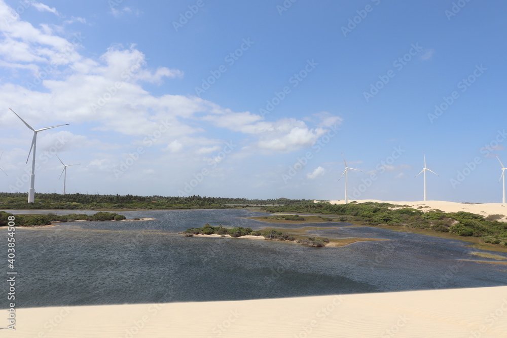 a lake near from the sea and a wind farm a lake near from the sea and a wind farm