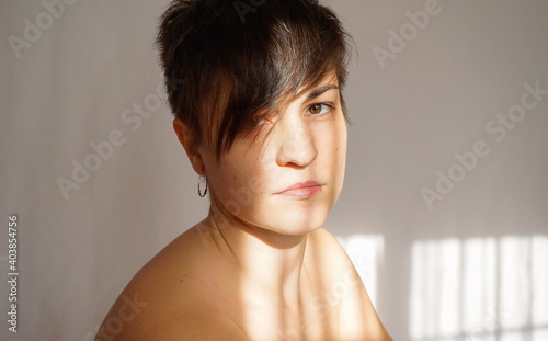 Portrait of an attractive androgynous woman in studio