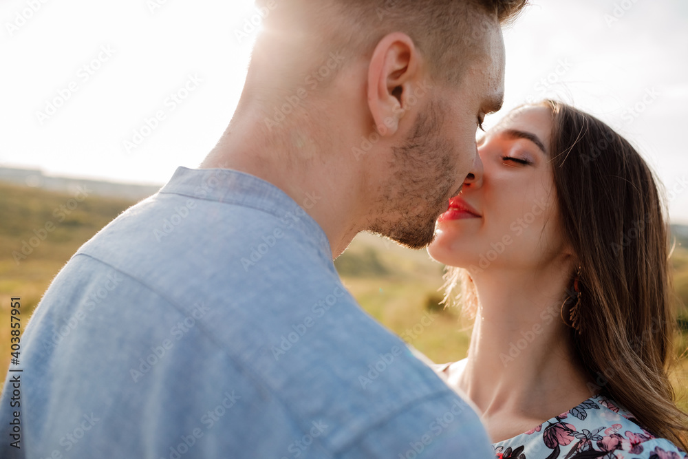 young loving couple hugging outside. concept of happiness and love. close up photo. love story young loving couple hugging outside. concept of happiness and love. close up photo. love story