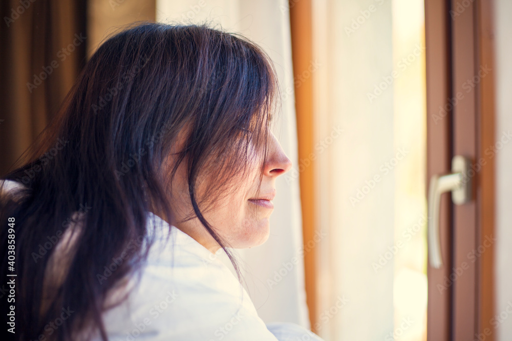 girl looks out the window with sadness, depression girl looks out the window with sadness, depression