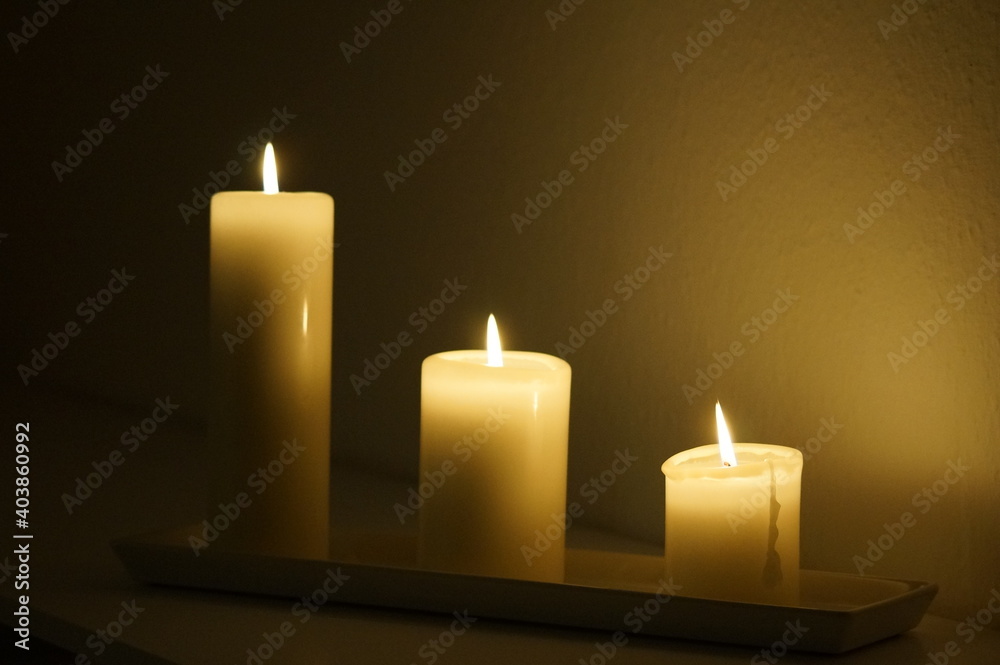 Three candles burning in the dark Three candles burning in the dark