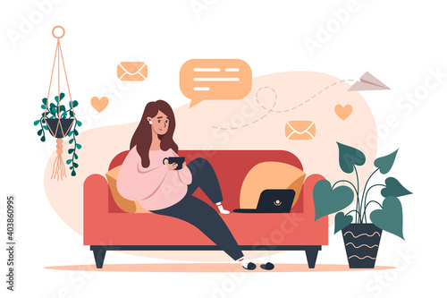 Woman sitting on couch and working on laptop, freelance and learning at home
